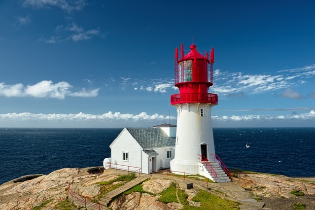 Beautiful lighthouse on the edge of rocky sea coast, South Norway, Lindesnes Fyr beacon